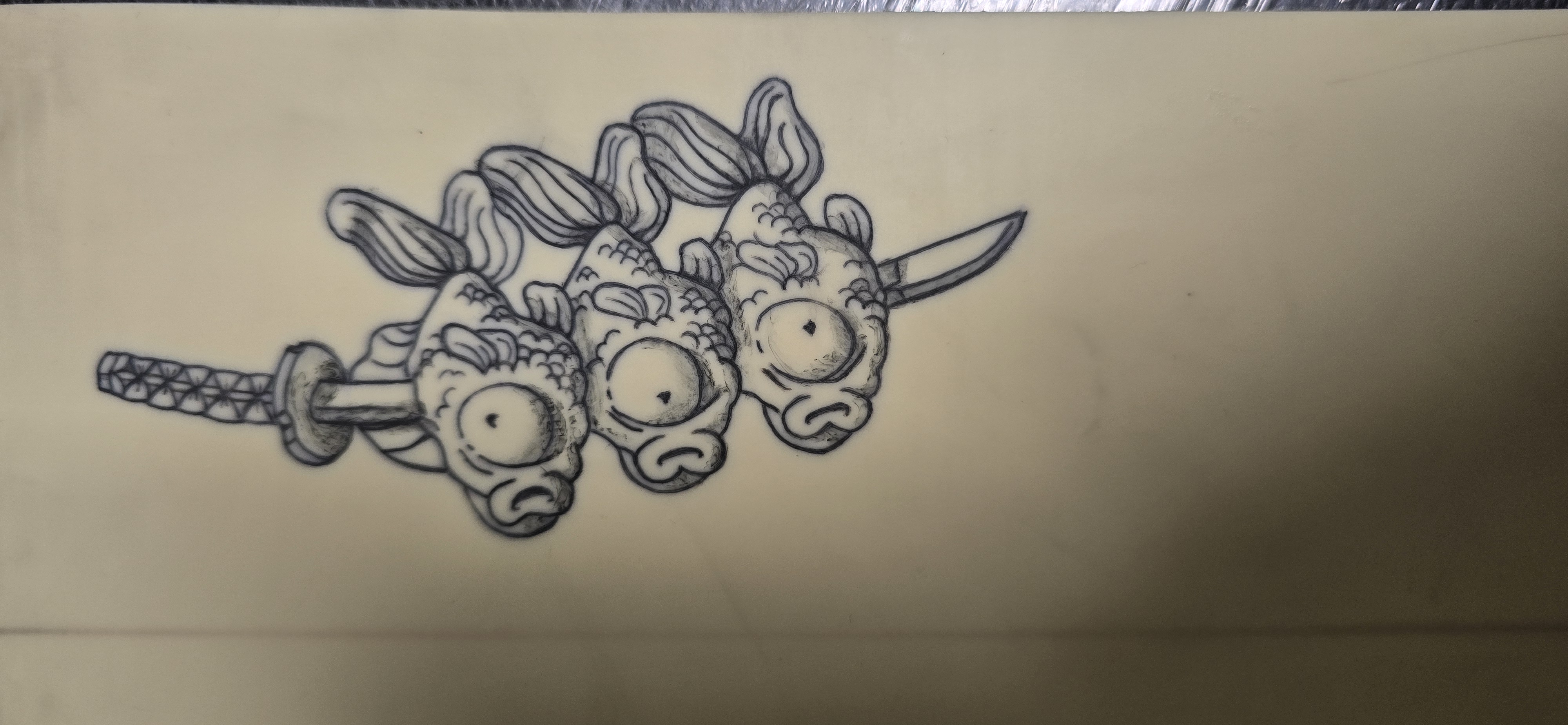 Tattooed fake skin practice piece